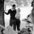 Newlyweds Marilyn Monroe and Arthur Miller are clearly in love as they both look longingly into each other's eyes after their wedding ceremony at Miller's White Plains New York home June 30th, 1956. Arthur's left arm is around Marilyn's waist with his right arm holding a cigarette against a tree. Other photographers can be seen snapping photos in this black and white image taken by Milton H Greene.